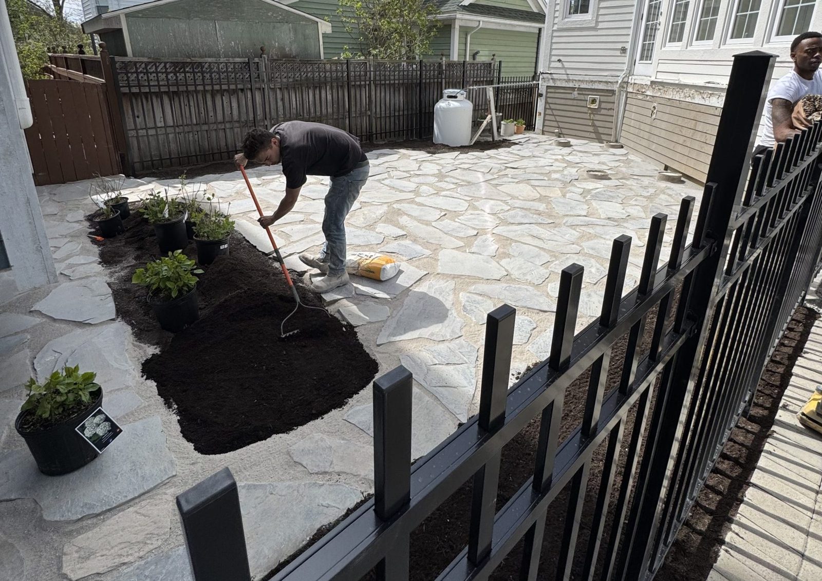 Finished backyard hardscape with fire pit area